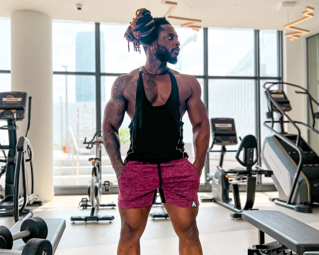 bodybuilding athlete wearing mens workout shorts in a gym